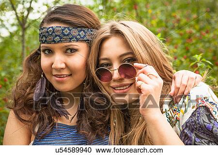 Two hippy girls looking at camera View Large Photo Image Stock Image - Two hippy girls looking at camera. Fotosearch