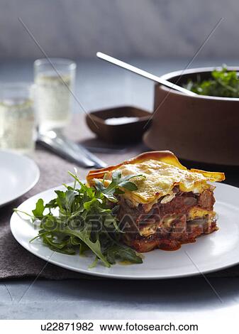 Stock Image - Veal and pork lasagne with rocket. Fotosearch