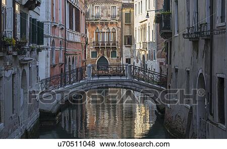 View of bridge and reflection on canal, Venice, Veneto, Italy View Large Photo Image Stock Photo - View of bridge and reflection on canal, Venice, Veneto, Italy. Fotosearch