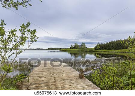 Stock Image - View of pier, Ellidavatn, Iceland. Fotosearch