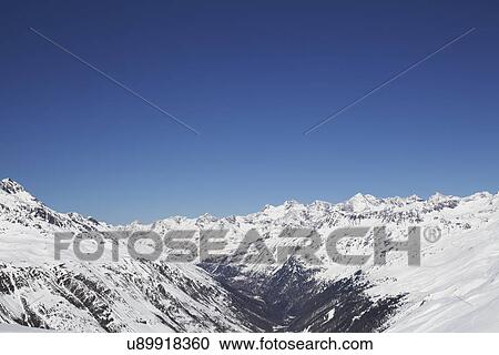 Stock Image - View of snow covered mountain range, Austria. Fotosearch