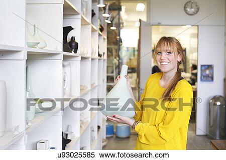 Woman holding ceramic vase in workshop View Large Photo Image Stock Photography - Woman holding ceramic vase in workshop. Fotosearch