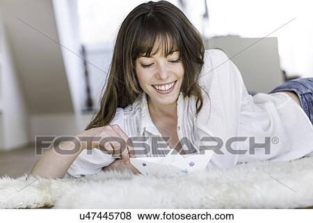 Woman playing with paper boat View Large Photo Image Stock Photo - Woman playing with paper boat. Fotosearch