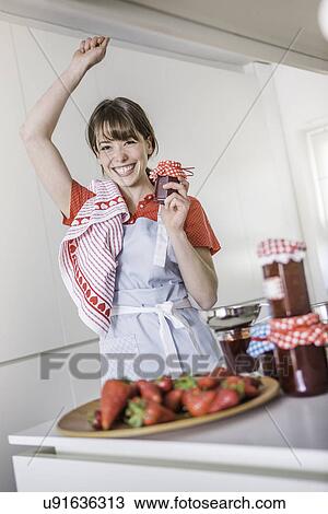 Woman proud of homemade strawberry jam View Large Photo Image Stock Image - Woman proud of homemade strawberry jam. Fotosearch