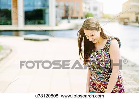 Woman standing by canal View Large Photo Image Stock Photography - Woman standing by canal. Fotosearch