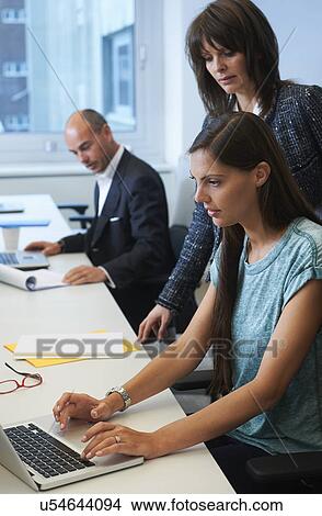 Woman typing View Large Photo Image Picture - Woman typing. Fotosearch