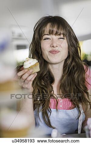 Woman with her cupcakes View Large Photo Image Stock Image - Woman with her cupcakes. Fotosearch