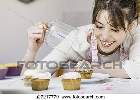 Woman with her cupcakes View Large Photo Image Stock Photo - Woman with her cupcakes. Fotosearch