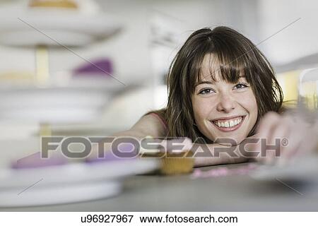 Woman with her cupcakes View Large Photo Image Stock Photo - Woman with her cupcakes. Fotosearch