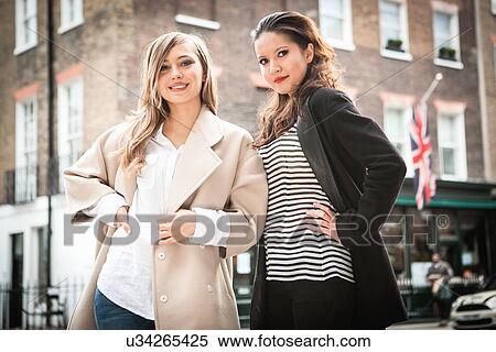 Stock Photography - Women posing on street, London, UK. Fotosearch