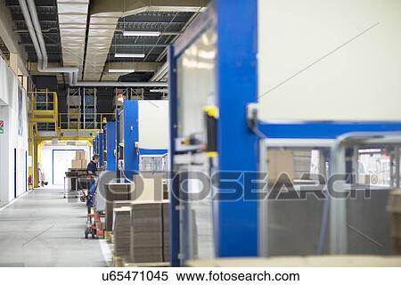 Worker in paper packaging factory View Large Photo Image Stock Photography - Worker in paper packaging factory. Fotosearch