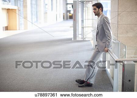 Young businessman waiting conference centre corridor View Large Photo Image Stock Image - Young businessman waiting conference centre corridor. Fotosearch
