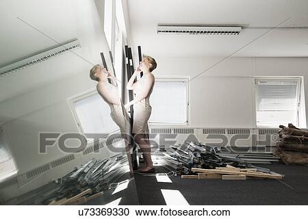 Young businesswoman chatting on smartphone in new office View Large Photo Image Stock Image - Young businesswoman chatting on smartphone in new office. Fotosearch