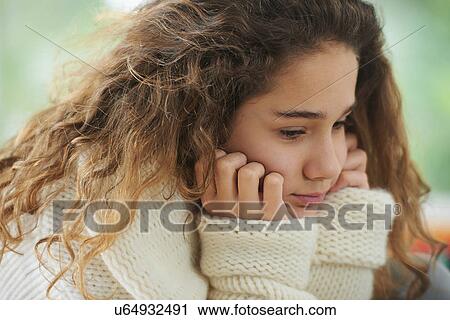 Young girl with brown hair, pensive expression View Large Photo Image Stock Image - Young girl with brown hair, pensive expression. Fotosearch