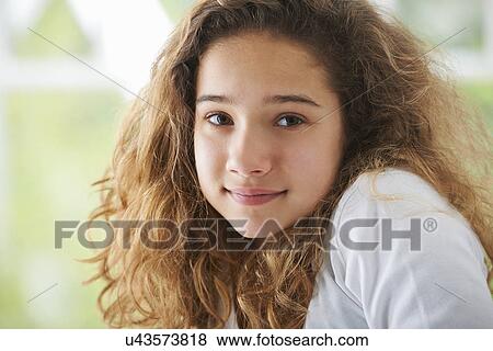 Young girl with brown hair, smiling, portrait View Large Photo Image Stock Photo - Young girl with brown hair, smiling, portrait. Fotosearch