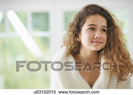Young girl with brown hair, smiling, portrait View Large Photo Image Stock Photography - Young girl with brown hair, smiling, portrait. Fotosearch
