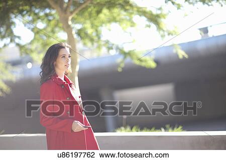 Young woman with smartphone in city underpass View Large Photo Image Stock Image - Young woman with smartphone in city underpass. Fotosearch
