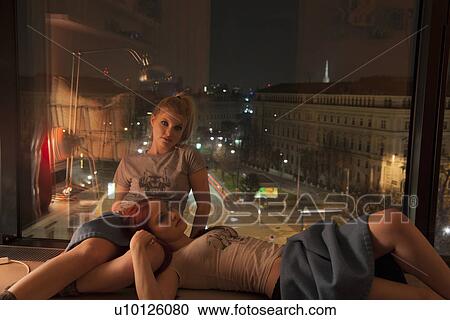 Young women resting by hotel window with view, Vienna, Austria View Large Photo Image Stock Image - Young women resting by hotel window with view, Vienna, Austria. Fotosearch