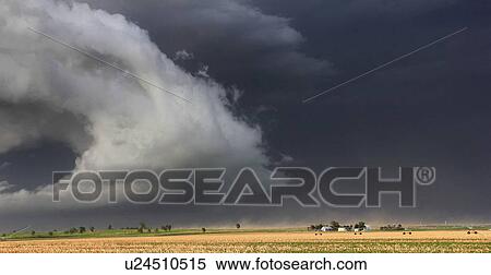 A dramatic gust front sweeps down over the crops of this farm, kicking up dust and intense winds, Lexington, Nebraska, USA View Large Photo Image Stock Photography - A dramatic gust front sweeps down over the crops of this farm, kicking up dust and intense winds, Lexington, Nebraska, USA. Fotosearch