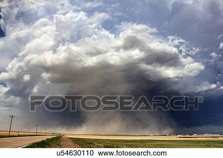 A massive supercell sucks up dust into the updraft leading to a violent dust storm, Sheridan Lake, Colorado, USA View Large Photo Image Stock Image - A massive supercell sucks up dust into the updraft leading to a violent dust storm, Sheridan Lake, Colorado, USA. Fotosearch