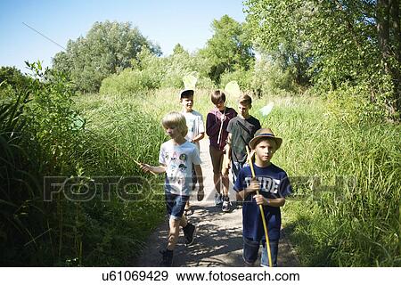 Stock Photo - Boys with fishing nets. Fotosearch
