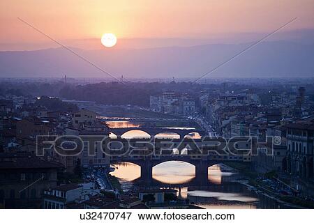 Stock Photo - Cityscape with Arno river at sunset, Florence, Tuscany, Italy. Fotosearch