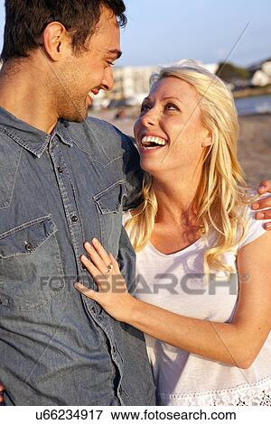 Close up of young couple enjoying beach View Large Photo Image Stock Photo - Close up of young couple enjoying beach. Fotosearch