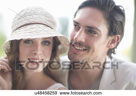 Stock Photo - Close up portrait of smiling couple in garden. Fotosearch