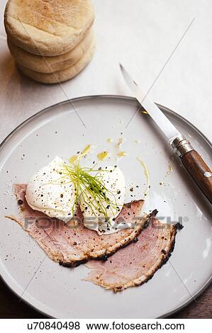 Stock Photo - Cold meat and poached eggs. Fotosearch