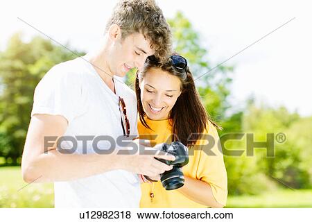 Stock Photo - Couple looking at camera. Fotosearch