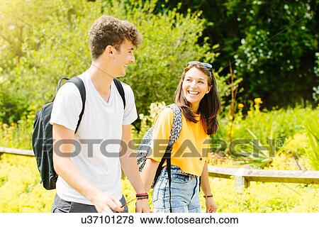 Stock Photo - Couple walking in the park. Fotosearch