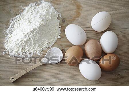 Eggs and flour, close-up View Large Photo Image Stock Photo - Eggs and flour, close-up. Fotosearch