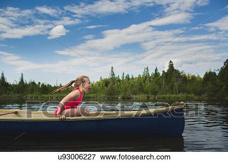 Excited girl sitting in canoe on Indian river, Ontario, Canada View Large Photo Image Stock Photo - Excited girl sitting in canoe on Indian river, Ontario, Canada. Fotosearch