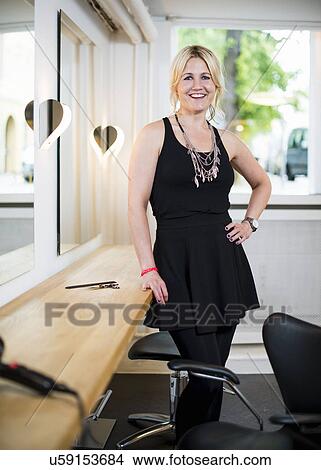 Female business owner in hair salon, portrait View Large Photo Image Picture - Female business owner in hair salon, portrait. Fotosearch