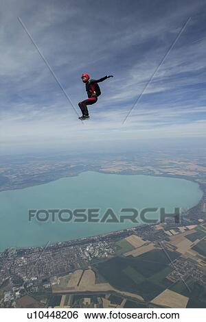 Female skydiver free falling above Siofok, Somogy, Hungary View Large Photo Image Stock Photograph - Female skydiver free falling above Siofok, Somogy, Hungary. Fotosearch