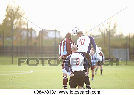 Football player heading ball View Large Photo Image Stock Photo - Football player heading ball. Fotosearch