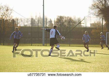 Football player kicking ball View Large Photo Image Stock Image - Football player kicking ball. Fotosearch