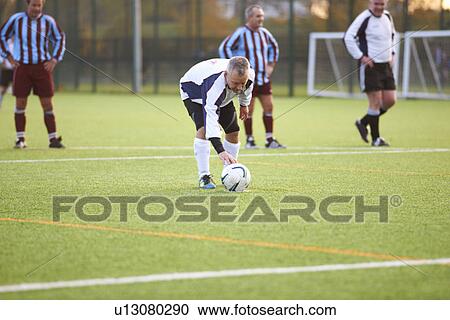 Football player positioning ball View Large Photo Image Stock Image - Football player positioning ball. Fotosearch
