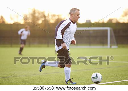 Football player with possession of ball View Large Photo Image Stock Photo - Football player with possession of ball. Fotosearch