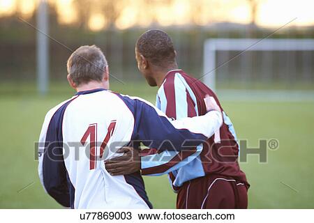 Football players at end of game View Large Photo Image Stock Image - Football players at end of game. Fotosearch