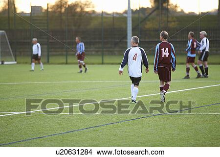 Picture - Football players at stop in game. Fotosearch