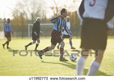 Football players during game View Large Photo Image Stock Image - Football players during game. Fotosearch