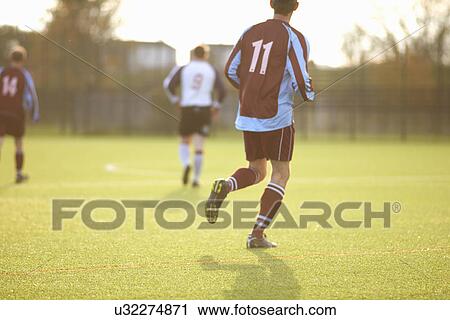 Football players during game View Large Photo Image Stock Image - Football players during game. Fotosearch
