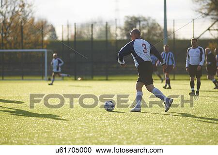 Football players during game View Large Photo Image Stock Image - Football players during game. Fotosearch