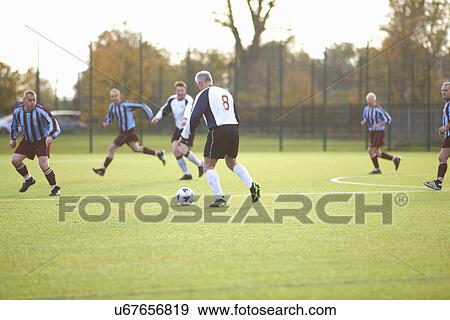 Football players during game View Large Photo Image Stock Photo - Football players during game. Fotosearch
