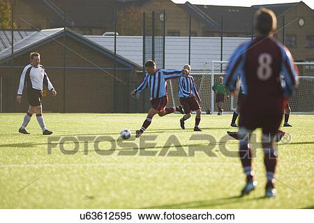 Stock Photography - Football players during game. Fotosearch