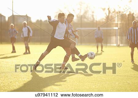 Football players fighting for ball View Large Photo Image Stock Image - Football players fighting for ball. Fotosearch