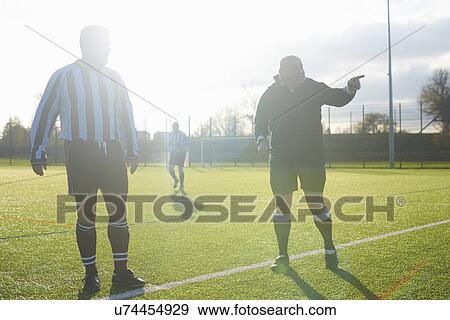 Football players starting game View Large Photo Image Stock Photo - Football players starting game. Fotosearch