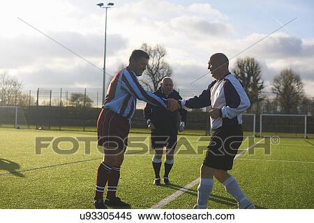 Football players starting game View Large Photo Image Stock Photography - Football players starting game. Fotosearch