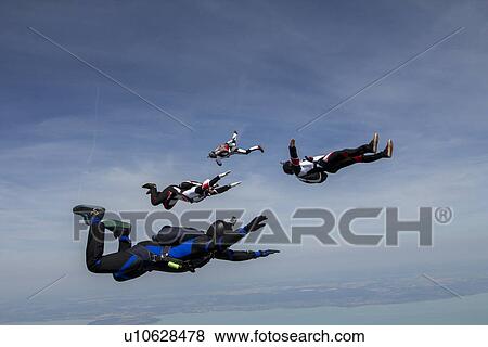 Four young adult male skydivers free falling, Siofok, Somogy, Hungary View Large Photo Image Stock Photo - Four young adult male skydivers free falling, Siofok, Somogy, Hungary. Fotosearch